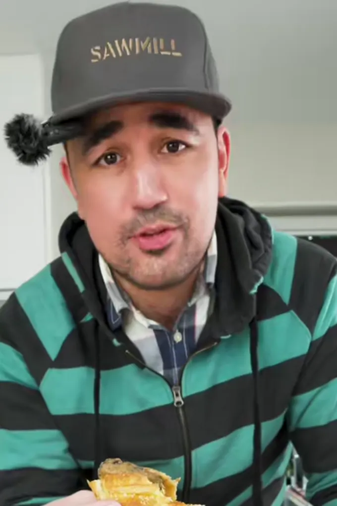 Example post, a story: a man in a cap in his kitchen holding up a pie